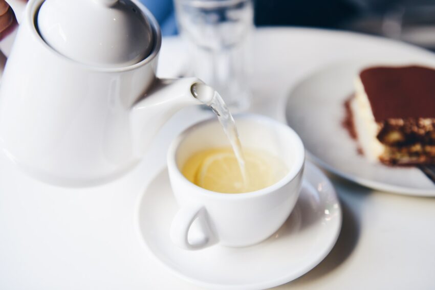 white ceramic teapot and teacup
